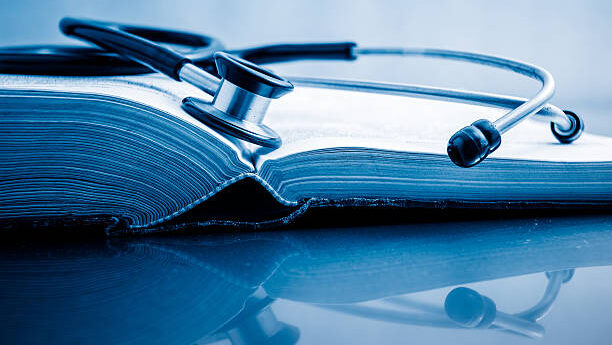 Books treatment stethoscope and books on white background. hospital and library stock pictures, royalty-free photos & images