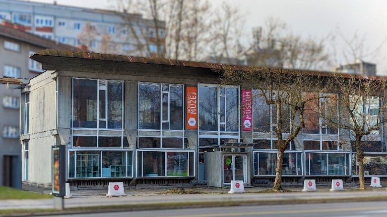 A building with many windows Description automatically generated